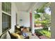 Cozy front porch with comfortable seating, decorative pillows, and a charming view of the neighborhood at 1145 Denton St, Lakeland, FL 33803