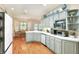 Well-equipped kitchen with hardwood floors, view of a dining area, and ample counter space at 1145 Denton St, Lakeland, FL 33803