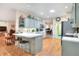 Well-lit kitchen with a breakfast bar, view of a nearby office, and hardwood floors at 1145 Denton St, Lakeland, FL 33803