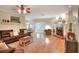 Open-concept living room featuring a fireplace, a brown sectional and French doors at 1145 Denton St, Lakeland, FL 33803