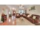 Spacious living room featuring hardwood floors and a comfortable, large sectional sofa at 1145 Denton St, Lakeland, FL 33803