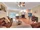 Cozy living room with a fireplace and a comfortable brown sectional sofa at 1145 Denton St, Lakeland, FL 33803