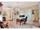 Comfortable home office with dual monitors, complemented by a traditional rocking chair at 1145 Denton St, Lakeland, FL 33803