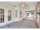 Enclosed sunroom with windows on three sides and ceiling fans at 1145 Denton St, Lakeland, FL 33803