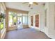 Screened in porch with ceiling fan and view of the exterior landscaped yard at 1145 Denton St, Lakeland, FL 33803