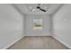 Bedroom with hardwood floors, bright light and ceiling fan at 1170 Windjammer Dr, Lakeland, FL 33803