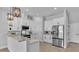 Bright kitchen features white cabinets, stainless steel appliances, and a stylish marble countertop at 1170 Windjammer Dr, Lakeland, FL 33803