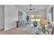 Relaxing living room featuring comfortable seating, light-colored furnishings, and sliding glass doors at 1170 Windjammer Dr, Lakeland, FL 33803