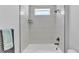 Stylish shower and tub combination with bright white tile at 1172 Windjammer Dr, Lakeland, FL 33803