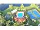 An aerial photograph displays a community clubhouse, pool, tennis courts, basketball court, and playground at 11761 Bella Milano Ct, Windermere, FL 34786