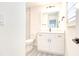 Bright bathroom with a white vanity, modern fixtures, and wood-look tile flooring at 11761 Bella Milano Ct, Windermere, FL 34786