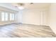 Large bedroom featuring new floors, modern lighting, and abundant closet space at 11761 Bella Milano Ct, Windermere, FL 34786