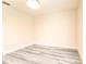 Empty bedroom showcasing wood-look flooring and a ceiling light at 11761 Bella Milano Ct, Windermere, FL 34786
