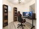 Bright bedroom set up as a gaming room with desk, chair, and bookcases at 11761 Bella Milano Ct, Windermere, FL 34786