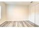 Bright bedroom featuring wood-look flooring and closet with double doors at 11761 Bella Milano Ct, Windermere, FL 34786