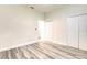 This bedroom features modern flooring, ample closet space, and an open doorway into the rest of the house at 11761 Bella Milano Ct, Windermere, FL 34786