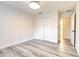 Bright bedroom with wood-look floors, and a closet with double doors at 11761 Bella Milano Ct, Windermere, FL 34786