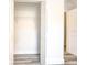 Empty closet with a wire shelf and a view into the brightly lit bedroom at 11761 Bella Milano Ct, Windermere, FL 34786