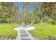 Backyard fire pit area with chairs and stone walkway, ideal for outdoor gatherings at 11761 Bella Milano Ct, Windermere, FL 34786
