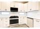 Kitchen featuring white cabinets, stainless appliances, quartz countertops, and a tiled backsplash with modern finishes at 11761 Bella Milano Ct, Windermere, FL 34786