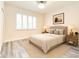 This bedroom features modern flooring, natural light, and is elegantly furnished and decorated at 11761 Bella Milano Ct, Windermere, FL 34786
