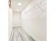Walk-in closet features built-in wire shelving and stylish wood-look flooring at 11761 Bella Milano Ct, Windermere, FL 34786