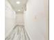 Walk-in closet features built-in wire shelving, overhead lighting and gray wood floors at 11761 Bella Milano Ct, Windermere, FL 34786