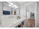 Bright bathroom featuring a vintage sink, ample lighting, and stylish fixtures at 1307 Fairlee St, Lakeland, FL 33813