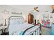 Stylized bedroom with metal frame bed, area rug, ceiling fan, and bright, natural light at 1307 Fairlee St, Lakeland, FL 33813