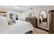 Bedroom showcasing an access to the outdoor pool area, wood floors, and natural light at 1307 Fairlee St, Lakeland, FL 33813