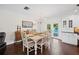 Elegant dining room with a view of the pool through glass doors at 1307 Fairlee St, Lakeland, FL 33813