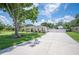 Exterior showing long driveway leading to an RV parking spot and a single-story home at 1307 Fairlee St, Lakeland, FL 33813