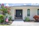 Close up of the front door, showing landscaping and a decorative wreath at 1307 Fairlee St, Lakeland, FL 33813