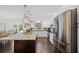 Kitchen showing an island, stainless steel appliances, and white cabinets at 1307 Fairlee St, Lakeland, FL 33813
