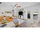 Bright living room with access to outdoor patio, leather sofa, and modern decor at 1307 Fairlee St, Lakeland, FL 33813
