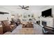 Cozy living room with fireplace, comfortable seating, and natural light at 1307 Fairlee St, Lakeland, FL 33813