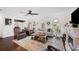 Inviting living room featuring stylish decor, arched windows, and ample seating at 1307 Fairlee St, Lakeland, FL 33813