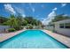Stunning pool area surrounded by lush greenery and a spacious patio at 1307 Fairlee St, Lakeland, FL 33813