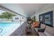 Inviting covered patio with comfortable seating overlooking the sparkling pool at 1307 Fairlee St, Lakeland, FL 33813