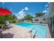 Inviting pool surrounded by lush landscaping, creating a private backyard retreat at 1307 Fairlee St, Lakeland, FL 33813