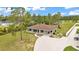 Expansive aerial view of the property featuring a sprawling lawn and mature trees at 13522 Rockridge Rd, Lakeland, FL 33809