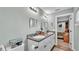 Elegant bathroom featuring a double sink vanity, granite countertop, and modern fixtures at 13522 Rockridge Rd, Lakeland, FL 33809