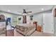 Cozy bedroom with a ceiling fan, natural light, and neutral color scheme at 13522 Rockridge Rd, Lakeland, FL 33809