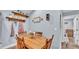 Dining area featuring a wooden table, rustic decor, and view into adjacent room at 13522 Rockridge Rd, Lakeland, FL 33809