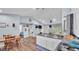 Open-concept kitchen featuring a central island, breakfast bar, and wooden flooring at 13522 Rockridge Rd, Lakeland, FL 33809