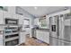 Bright kitchen with stainless steel appliances and easy access to the laundry room at 13522 Rockridge Rd, Lakeland, FL 33809