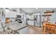 Bright kitchen with stainless steel appliances, granite countertops and wooden dining table at 13522 Rockridge Rd, Lakeland, FL 33809