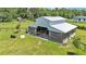 Spacious barn with metal roof, wooden siding, and fenced enclosure at 1385 Ewell Rd, Lakeland, FL 33811