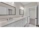 Well-appointed bathroom featuring double sinks, granite counters, and modern lighting at 1385 Ewell Rd, Lakeland, FL 33811