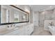 Beautiful bathroom with double sinks, walk in shower, and a free standing tub at 1385 Ewell Rd, Lakeland, FL 33811